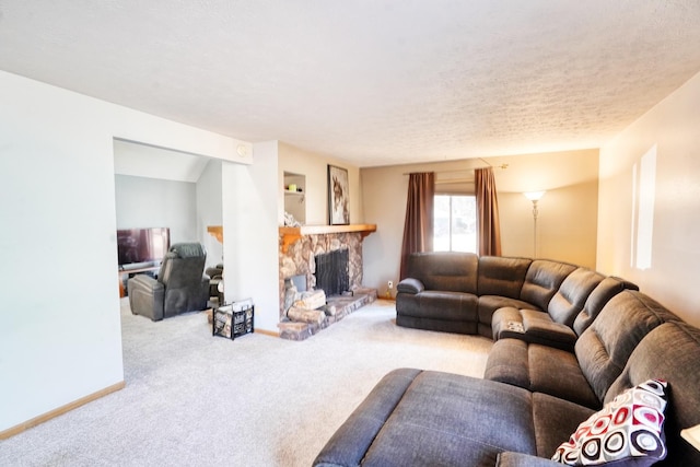 living area featuring a textured ceiling, a fireplace, baseboards, and carpet flooring