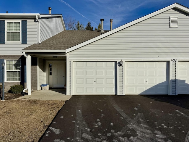 view of front of home with a garage