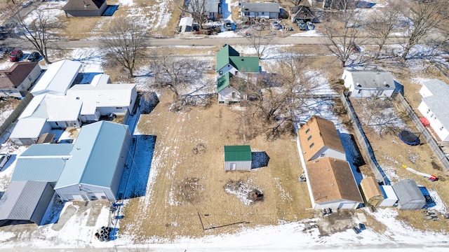 snowy aerial view with a residential view