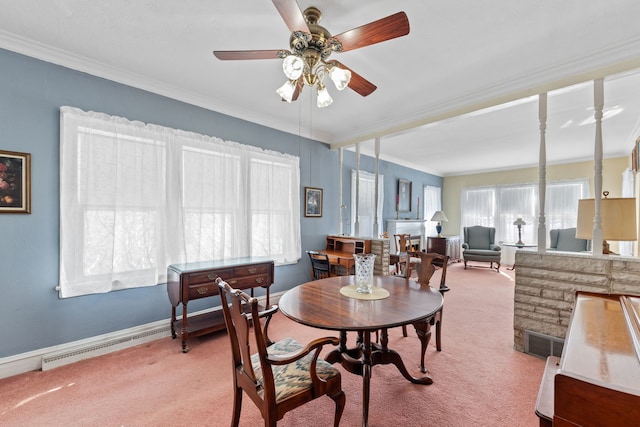 dining area featuring ornamental molding, light carpet, and ceiling fan