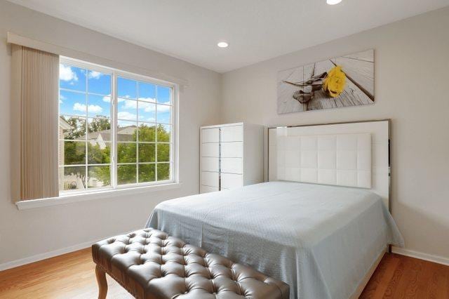 bedroom featuring wood-type flooring