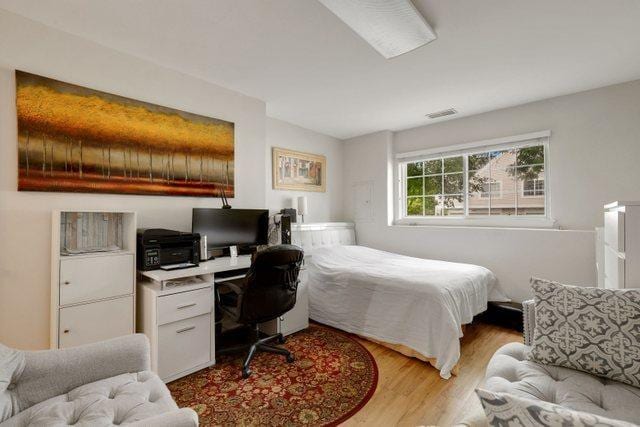 bedroom with light hardwood / wood-style flooring