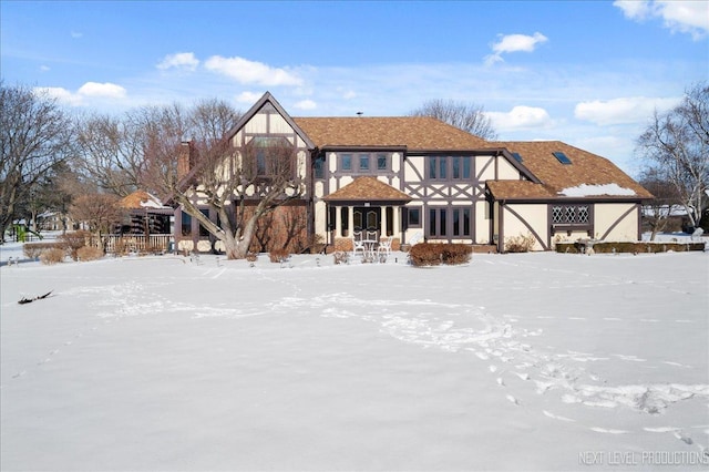 view of snow covered house