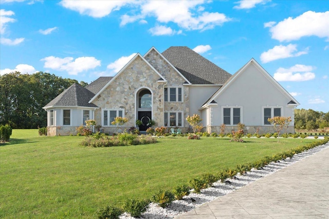 view of front of home with a front lawn