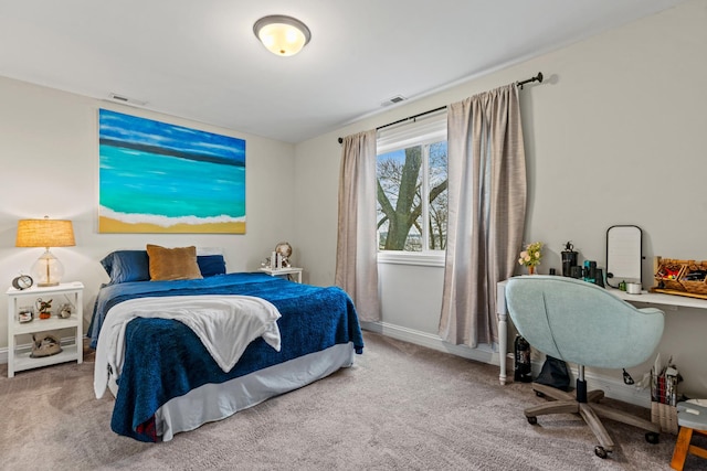 carpeted bedroom featuring visible vents and baseboards