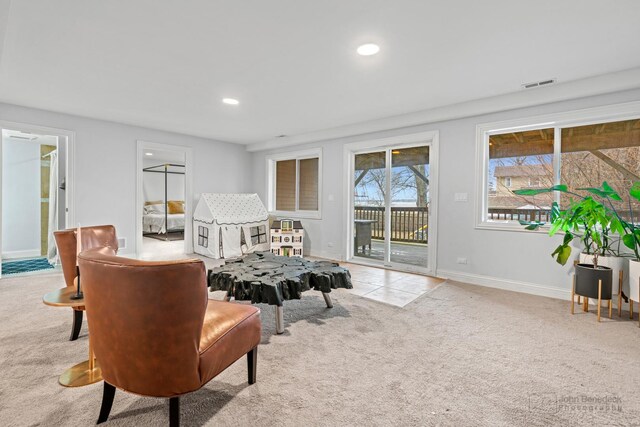 living area with recessed lighting, carpet floors, visible vents, baseboards, and tile patterned floors