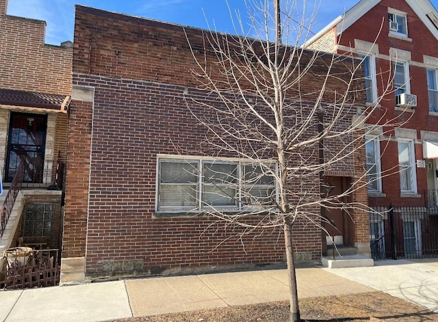 view of building exterior with cooling unit