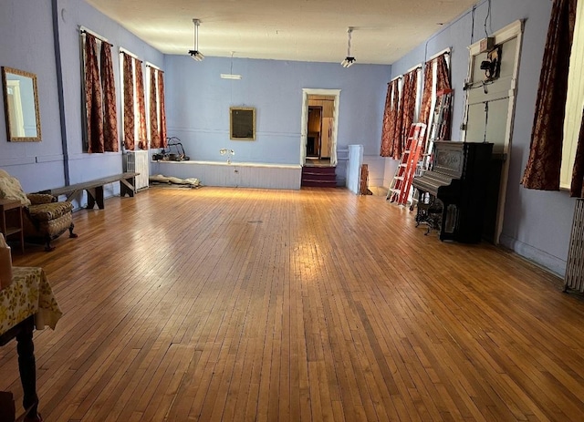 unfurnished living room with wood-type flooring