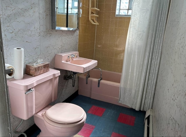 full bathroom with shower / bath combination with curtain, toilet, sink, and a wealth of natural light