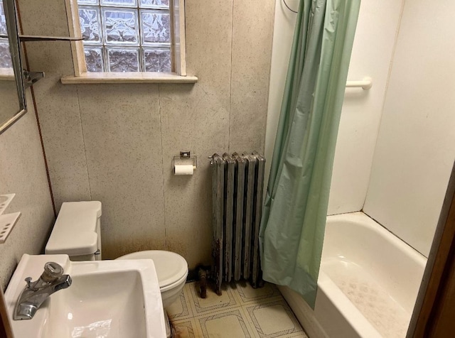 full bathroom featuring radiator, toilet, sink, and shower / bath combo