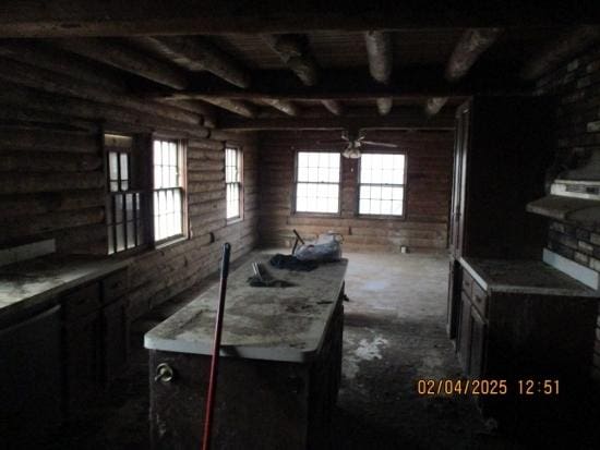 125 N Anderson Rd, New Lenox, IL 60451 - interior space featuring light countertops, beamed ceiling, and log walls