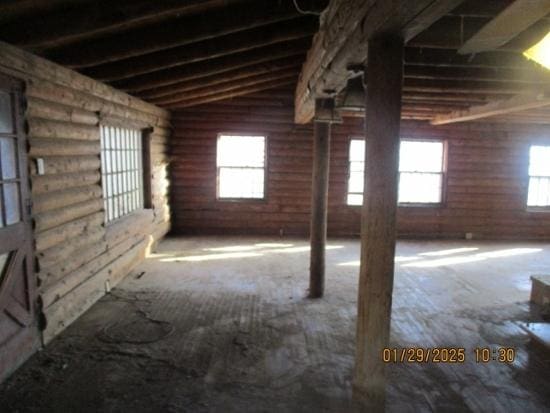 125 N Anderson Rd, New Lenox, IL 60451 - interior space with a healthy amount of sunlight, vaulted ceiling with beams, and log walls