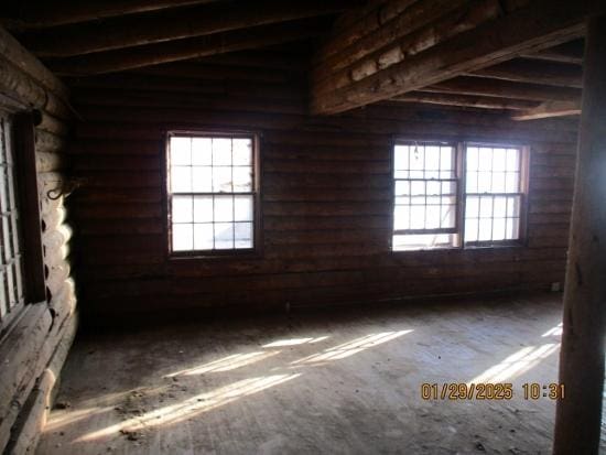 125 N Anderson Rd, New Lenox, IL 60451 - spare room with lofted ceiling with beams, log walls, and a wealth of natural light