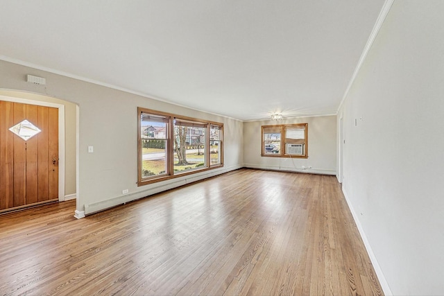 unfurnished living room with light wood-type flooring, baseboards, crown molding, and baseboard heating