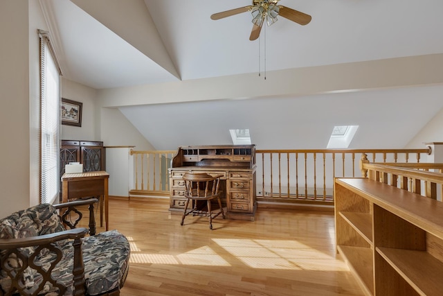 hallway featuring vaulted ceiling and light hardwood / wood-style floors