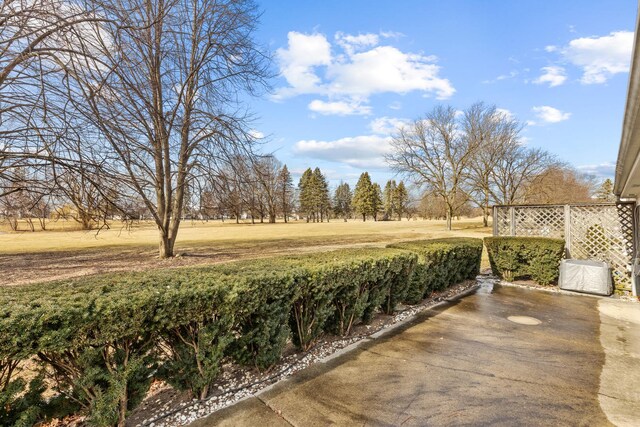 back of property featuring a garage and a yard