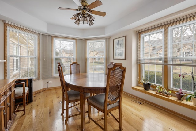 dining area featuring light hardwood / wood-style flooring and ceiling fan