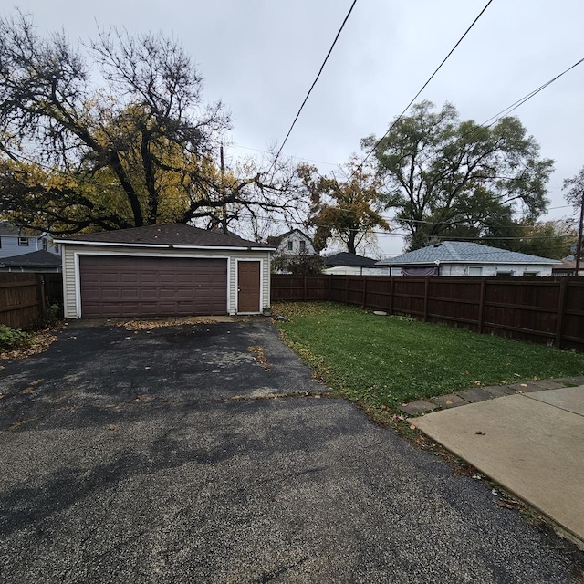 garage featuring a yard