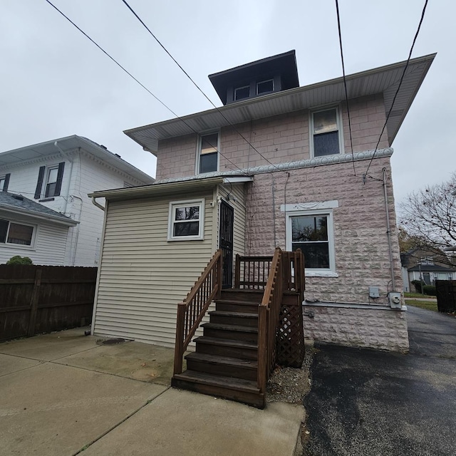 rear view of house with a patio