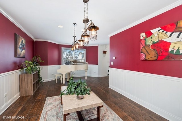 dining room with ornamental molding and dark hardwood / wood-style floors