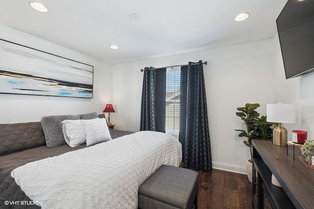 bedroom featuring dark hardwood / wood-style flooring