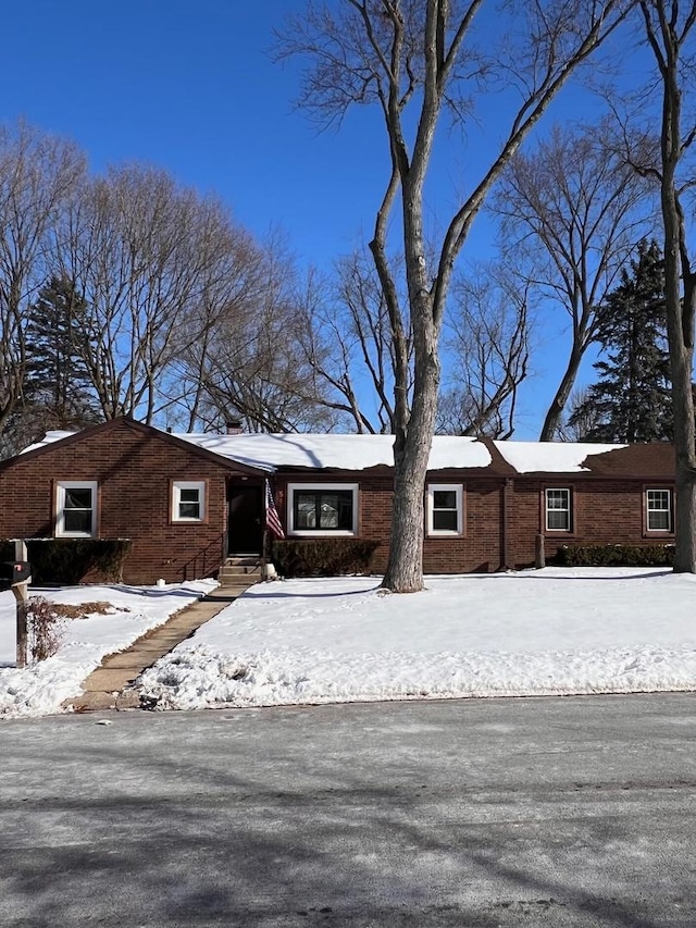 view of front of house with brick siding