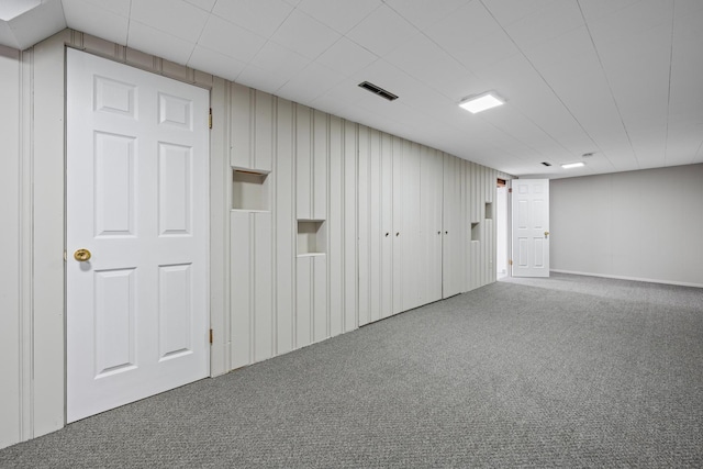 empty room featuring carpet and visible vents