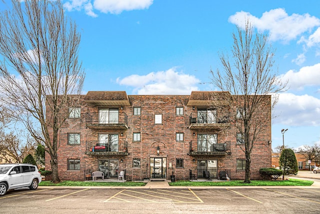 view of property with uncovered parking