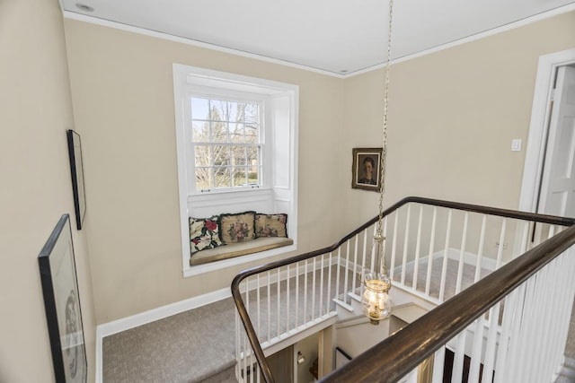 stairway featuring crown molding and baseboards