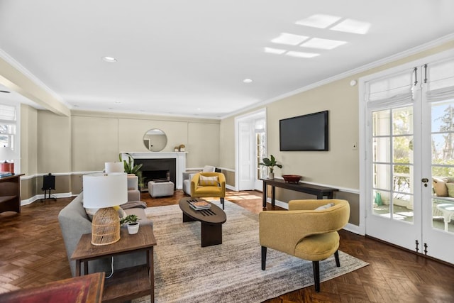 living room with crown molding, recessed lighting, a fireplace, and baseboards