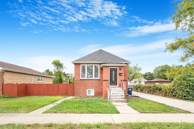 view of front of home with a front lawn