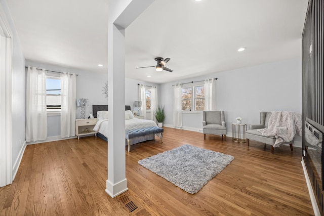 bedroom featuring wood-type flooring and ceiling fan