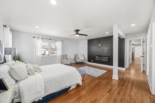 bedroom featuring ceiling fan and hardwood / wood-style floors