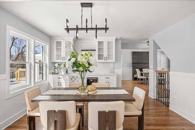 dining room with dark hardwood / wood-style flooring