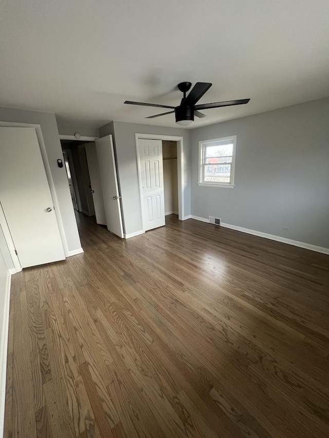 unfurnished bedroom with hardwood / wood-style flooring and ceiling fan