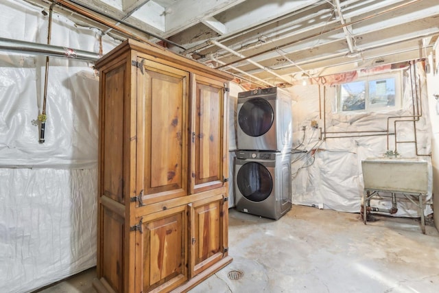 below grade area featuring stacked washer and dryer