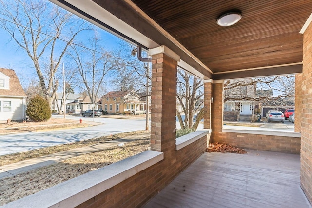 view of patio / terrace with a porch and a residential view