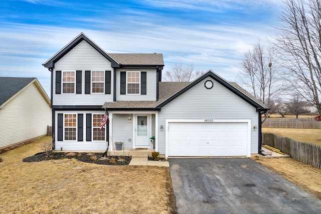 view of front of house with a garage and a front lawn