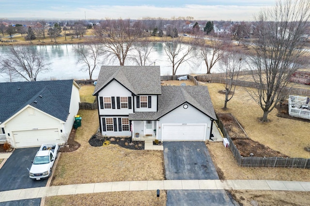 view of front of house featuring a water view and a garage