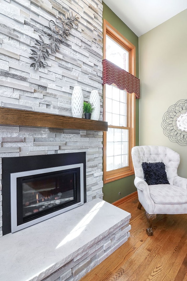 sitting room featuring hardwood / wood-style floors and a fireplace