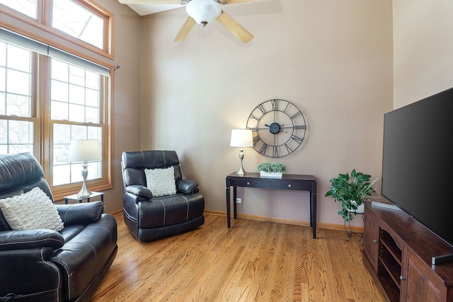 sitting room featuring ceiling fan and light hardwood / wood-style floors