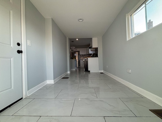 corridor featuring recessed lighting, marble finish floor, visible vents, and baseboards