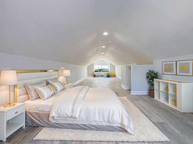 bedroom with light wood-type flooring, lofted ceiling, baseboards, and recessed lighting