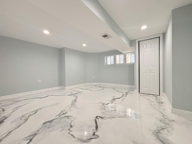 unfurnished room featuring baseboards, visible vents, and recessed lighting