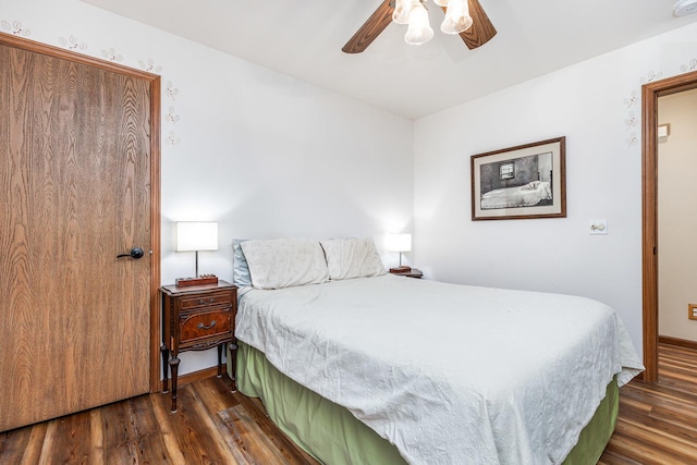 bedroom featuring dark wood-type flooring and ceiling fan