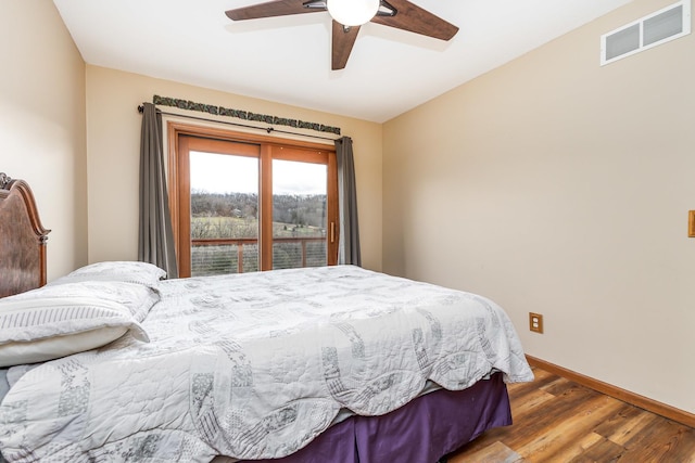 bedroom with hardwood / wood-style floors and ceiling fan