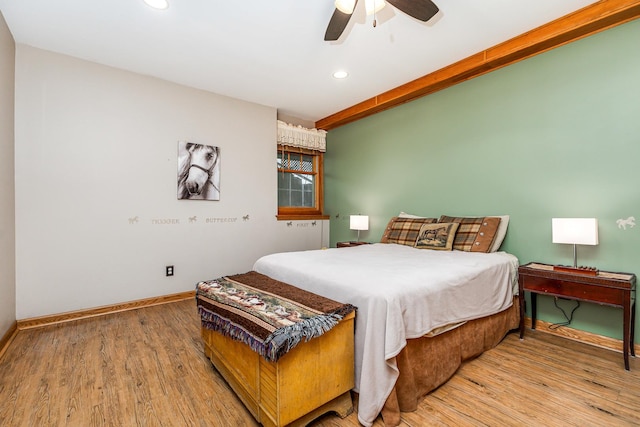 bedroom with wood-type flooring and ceiling fan