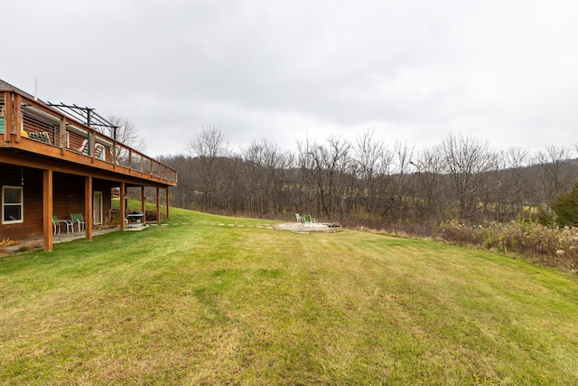 view of yard featuring a wooden deck