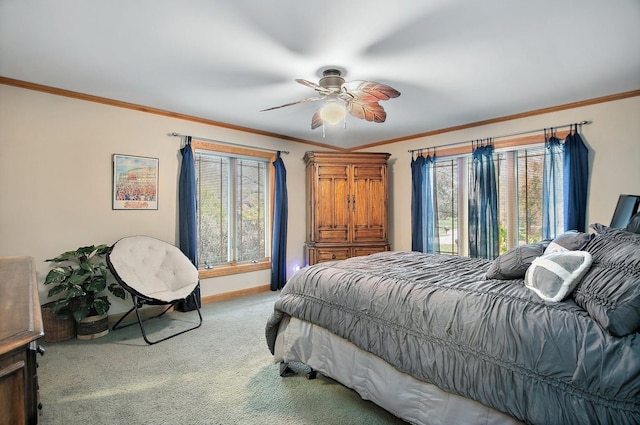 bedroom with crown molding, carpet flooring, and ceiling fan