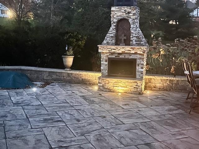 view of patio / terrace with an outdoor stone fireplace